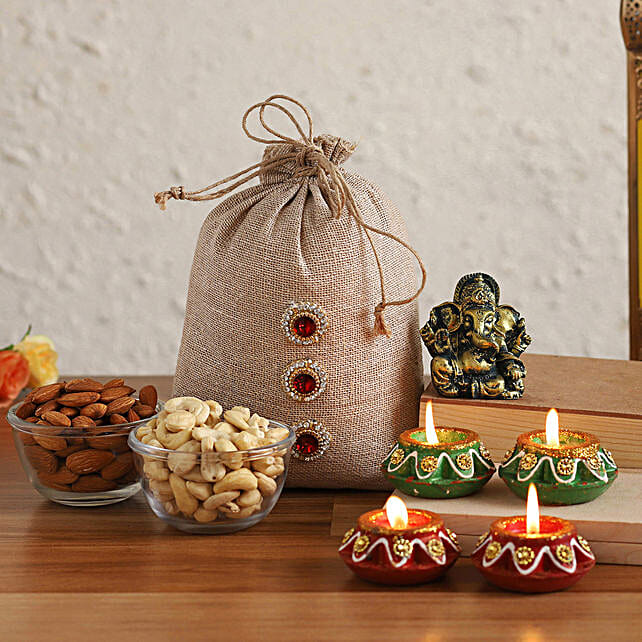 Buy Send Antique Ganesha Idol With Dried Nuts Potli Diyas Online Fnp