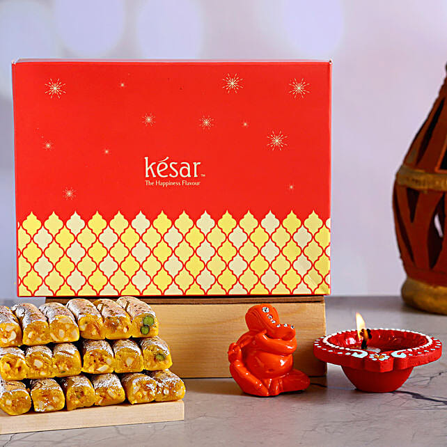 Buy Send Orange Ganesha Idol Diya With Kaju Kesar Rolls Online FNP