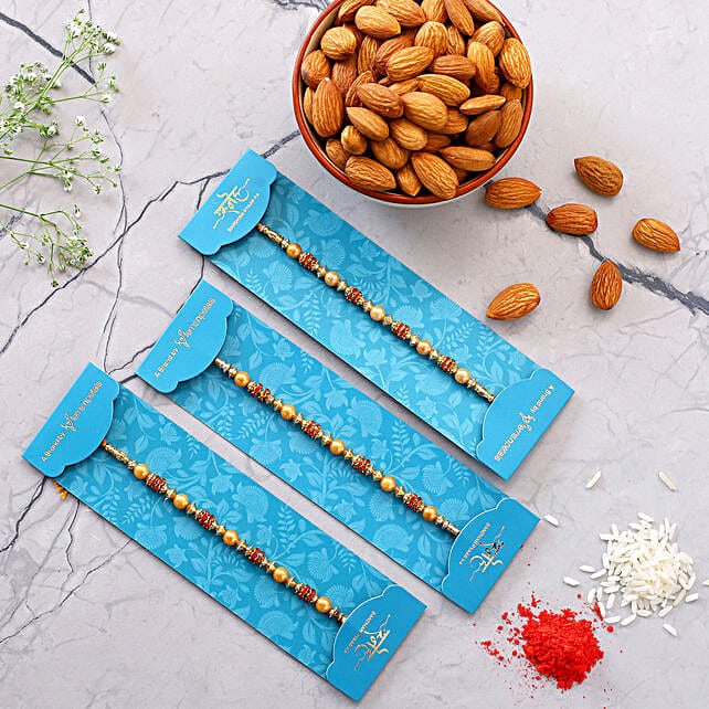 Traditional Pearl Studded Rakhis Set Of 3 With 100 Gms Almonds Qatar