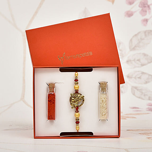 Bright Golden And Red Rakhi For Brother bahrain | Gift Bright Golden ...