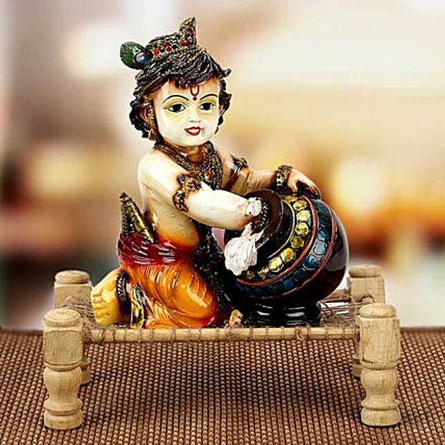 Buy/Send Bal Krishna With Matki on Charpai Online- FNP