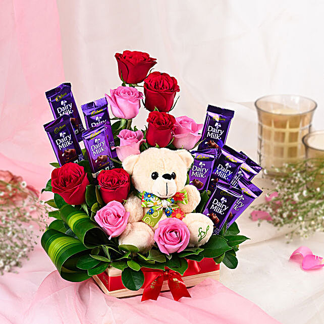 chocolates and teddy bear with roses