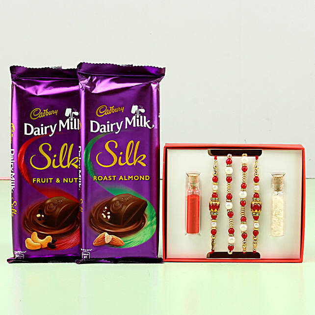 Buy/Send Pearl Rakhi Set & Dairy Milk Silk Combo Online FNP