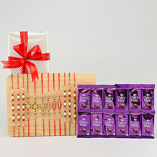 Buy/Send Set of 12 Rakhis & Dairy Milk Gift Pack Online FNP