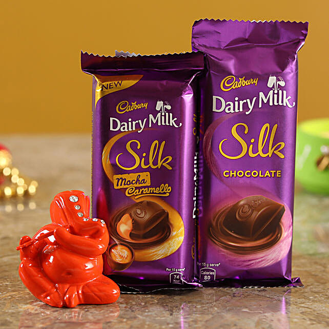 Buy/Send Dairy Milk Silk Combo With Orange Ganesha Idol Online FNP