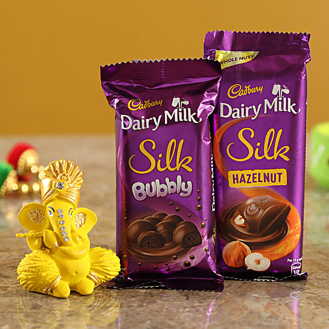 Buy/Send Dairy Milk Silk Hazelnut Bubbly Combo & Yellow Ganesha Idol