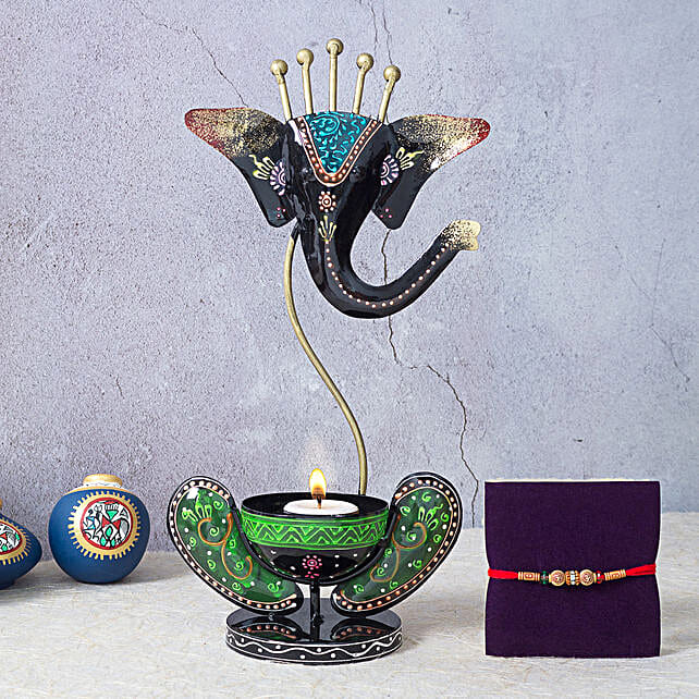 Buy/Send Designer Rakhi and Ganesha Candle Holder Online FNP