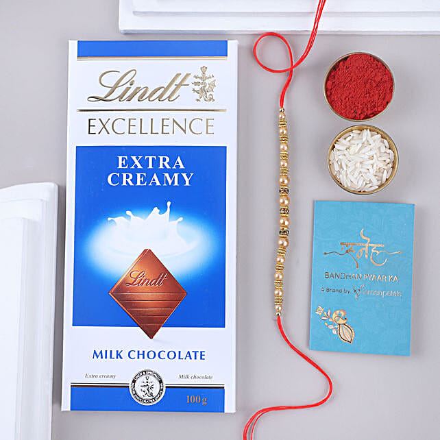 Sneh Minimal Pearl Rakhi & Lindt Chocolate Bar netherlands Gift Sneh