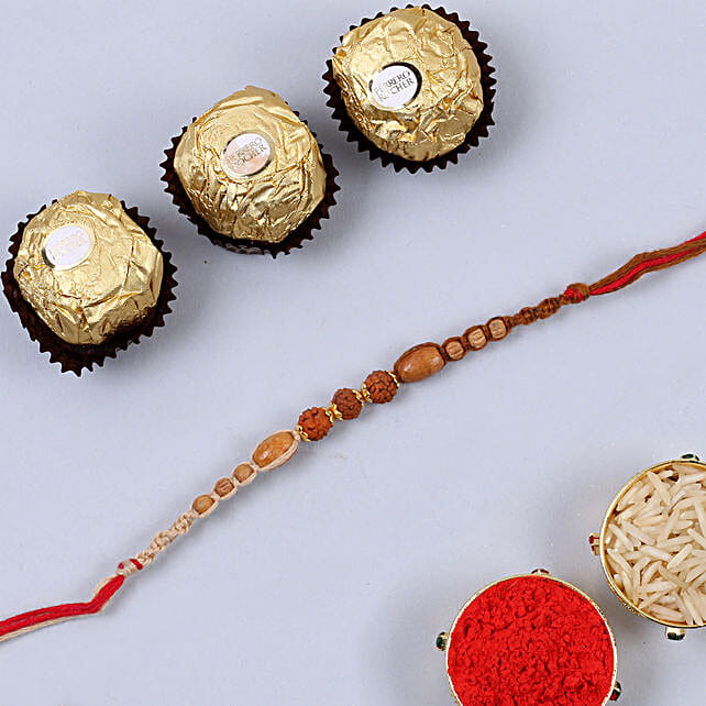 Elegant Red Rudraksh Rakhi And 3 Pcs Ferrero Rocher Singapore Gift Elegant Red Rudraksh Rakhi And 3 Pcs Ferrero Rocher Ferns N Petals