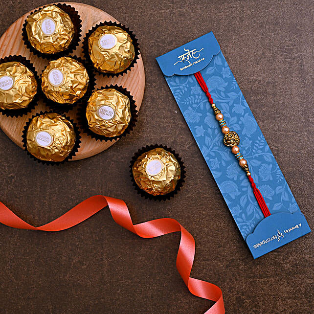 Lion Face Pearl Rakhi And 3 Pcs Ferrero Rocher Singapore Gift Lion Face Pearl Rakhi And 3 Pcs Ferrero Rocher Ferns N Petals