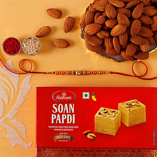 Rose Gold Pearl And Beads Rakhi with 250 Grams Soan Papdi and Almonds