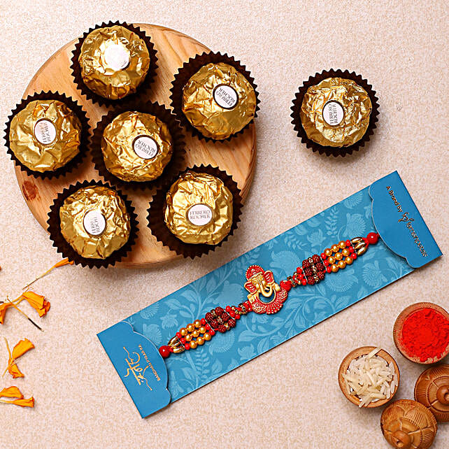 Ganesha And Rudraksha Rakhi With 3 Pcs Ferrero Rocher Usa Gift Ganesha And Rudraksha Rakhi With 3 Pcs Ferrero Rocher Ferns N Petals