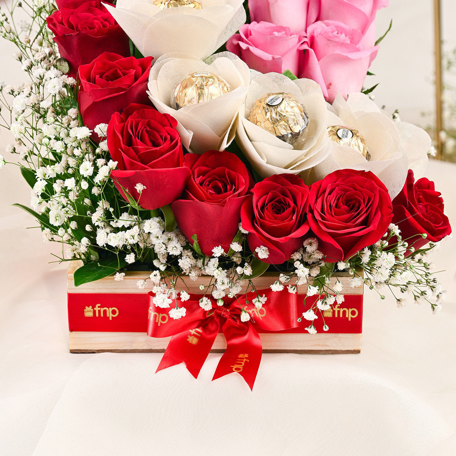 Buy/Send Red Roses & Ferrero Rocher Arrangement In Round FNP Box Online